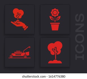 Set Tree in the ground, Tree in hand of environmental protection, Flower in pot and Lawn mower icon. Vector