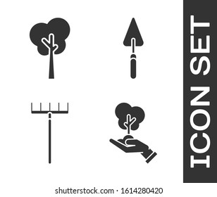 Set Tree in hand of environmental protection, Tree, Garden rake and Garden trowel spade or shovel icon. Vector