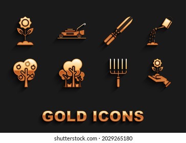 Set Trees, Watering can with water, Hand holding flower, Garden rake work, apple, Gardening handmade scissors for trimming, Flower and Lawn mower icon. Vector