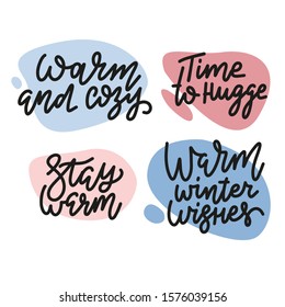 Set of trendy winter design elements and hand written lettering about christmas and winter holidays. Time to hugge, Warm and Cozy, Stay warm, Warm winter wishes hand written lettring phrases.