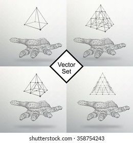 Set triangle pyramid on the arm. The hand holding a pyramid. Polygon triangle. Polygonal hand. The shadow of the objects in the background.