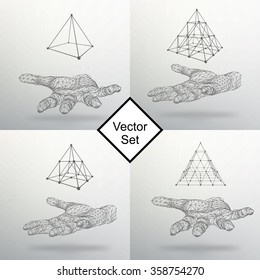 Set triangle pyramid on the arm. The hand holding a pyramid. Polygon triangle. Polygonal hand. The shadow of the objects in the background.