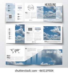 Set of tri-fold brochures, square design templates with element of world map and globe. Beautiful blue sky, abstract background with white clouds, leaflet cover, business layout, vector.