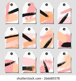 A set of twelve hand drawn brush strokes labels. Light and deep pink, black and pastel orange color palette.