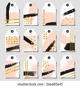 A set of twelve hand drawn brush strokes labels. Light pastel pink, black, white and golden color palette.