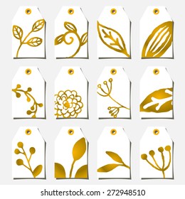 A set of twelve hand drawn floral design labels in golden and white.