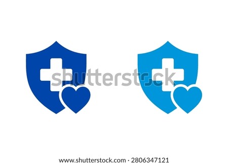 A set of two blue medical insurance icons featuring a protective shield with a white cross and a heart symbol representing healthcare and safety.