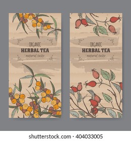 Set of two color vintage labels for dog rose and sea buckthorn herbal tea. Placed on cardboard texture.