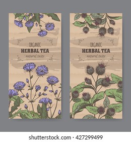 Set of two color vintage labels for burdock and chicory herbal tea. Placed on cardboard texture.