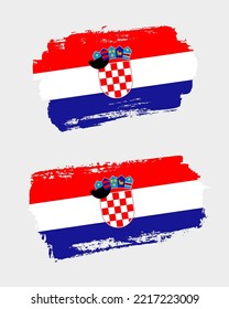 Set of two creative brush painted flags of Croatia country with solid background
