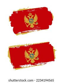 Set of two creative brush painted flags of Montenegro country with solid background