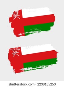 Set of two creative brush painted flags of Oman country with solid background