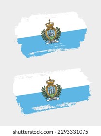 Set of two creative brush painted flags of San Marino country with solid background