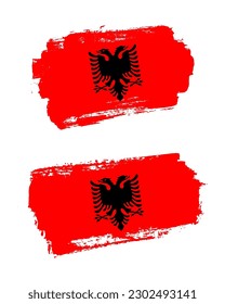Set of two creative brush painted flags of Albania country with solid background