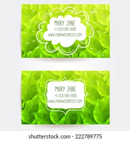 Set of two creative business card templates with artistic vector design. Green background with different leaves pattern. 