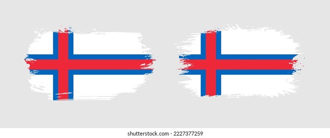 Set of two grunge brush flag of Faroe Islands on solid background