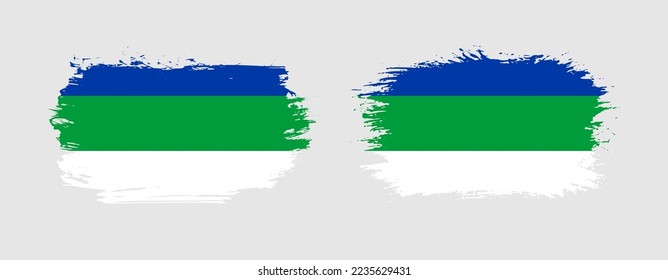 Set of two grunge brush flag of Komi Republic on solid background