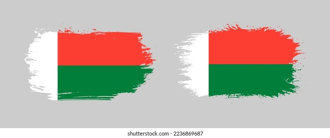 Set of two grunge brush flag of Madagascar on solid background
