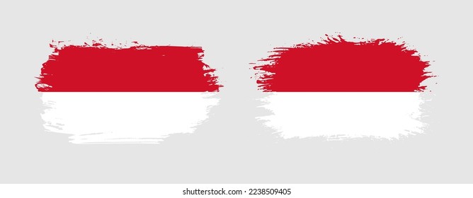 Set of two grunge brush flag of Monaco on solid background