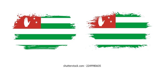 Set of two grunge brush flag of Abkhazia on solid background