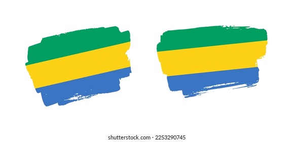 Conjunto de dos ilustraciones de la bandera del pincel de Gabón pintadas a mano sobre fondo sólido