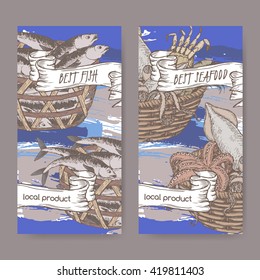 Set of two labels with, color fish and seafood baskets on hand painted blue background. Great for markets, fishing, fish processing, canned fish, seafood product label design.