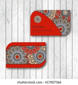 Set of two ornamental floral mandala cards, visiting template, red color. Vintage decorative elements. Indian, asian, arabic, islamic, ottoman motif. Vector illustration.