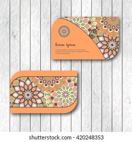 Set of two ornamental floral mandala cards, visiting template, orange colors. Vintage decorative elements. Indian, asian, arabic, islamic, ottoman motif. Vector illustration.