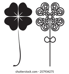 Set of two stylized images of black four-leaf clover in vector with celtic pattern.