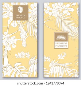 Set of two templates for label for premium product  or cards,  invitation, with tropical plants, palm, monsters, orchids and birds. Outline hand drawing vector illustration on soft yellow background.