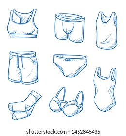 Set of underwear garments and fashion as: panties, boxer, shorts, bathing suit, socks, bra and tank top.  Hand drawn blue line art cartoon vector illustration. 