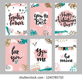 Set of Valentine's day greeting cards with hand written greeting words and modern brush strokes and painted splashes decoration on background