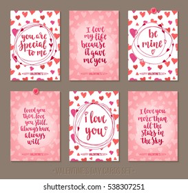 Set Valentine's Day greeting cards with handwritten brush calligraphy and decorative elements. Decorative vector illustration for season invitations, cards, posters and flyers.