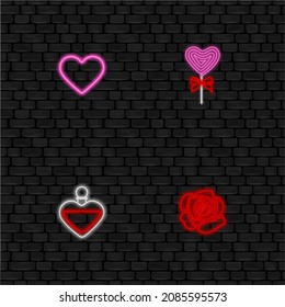 set of valentine's day neon symbols on black wall background