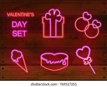 Set of Valentines neon objects: weeding rings, lollipop, ice cream, cake, gift box. Can be used on flyers banners or web. Modern neon style for romantic valentines day projects. Vector illustration.