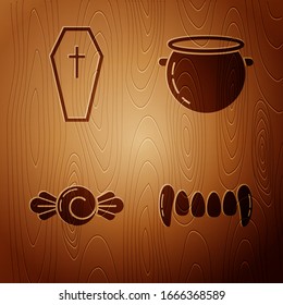 Set Vampire teeth , Coffin with christian cross , Candy  and Halloween witch cauldron  on wooden background. Vector