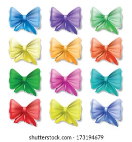 Set of varicolored bows on a white background.