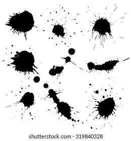 Set of various black ink blots on white background