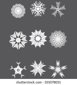 set of various carved, lace or simple white snowflakes