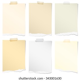 Set of various colors torn note papers with adhesive tape on white background
