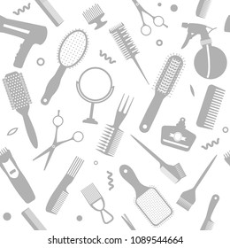 A set of various combs, a hairdryer, a mirror in a seamless pattern. Modern texture for hairdressing business and beauty salons. flat vector illustration