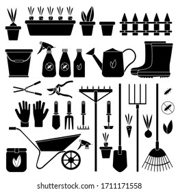 Set of various garden tools on an isolated white background. Equipment for agriculture. Flat design silhouettes illustration. Watering can, spade, bucket. Vector and stock illustration.