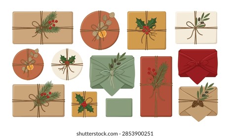 A set of various gift boxes and parcels illustrating sustainable wrapping techniques. The collection includes rectangular, round, and square packages wrapped in brown kraft paper, green and red fabric, and tied with natural twine. Decorations include botanical elements such as fir branches, holly leaves with red berries, eucalyptus, dried citrus slices, and olive sprigs on a plain white background.