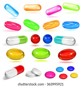 Set of various opaque multicolored capsules and pills on white background
