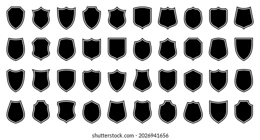 Set of various vintage shield icons. Black outlined heraldic shields. Protection and security symbol, label. Vector illustration.