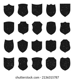 Set of various vintage shield icons. Black heraldic shields with grunge texture. Protection and security symbol, label. Vector illustration.