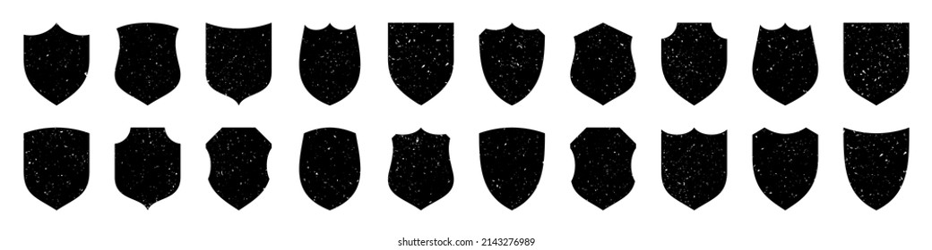 Set of various vintage shield icons. Black heraldic shields with grunge texture. Protection and security symbol, label. Vector illustration.