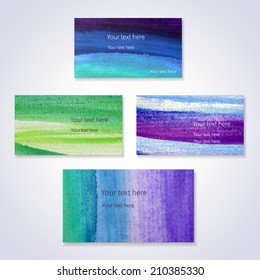 Set of vector business cards template with hand painted brush strokes backgrounds. Green, violet and blue colors.