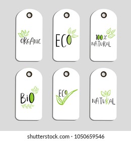 Set of Vector eco badge or tag, bio green logo. Vegan sign for cafe, restaurants, products packaging. Hand drawn leaves, branches, plant elements with lettering. Organic design template.