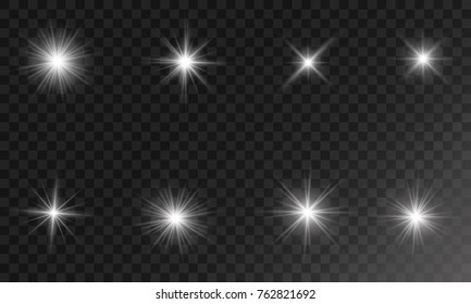 Set of Vector glowing light effect stars bursts with sparkles on transparent background.